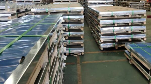 Cold rolled stainless steel sheets packed and stocked in a warehouse.