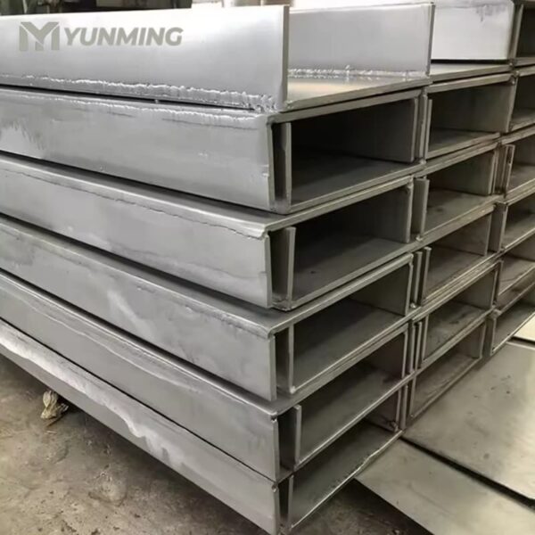 Large quantity of stainless steel U channels stacked in warehouse