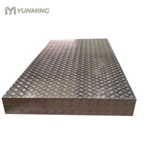 Stack of stainless steel checkered plates with embossed diamond patterns