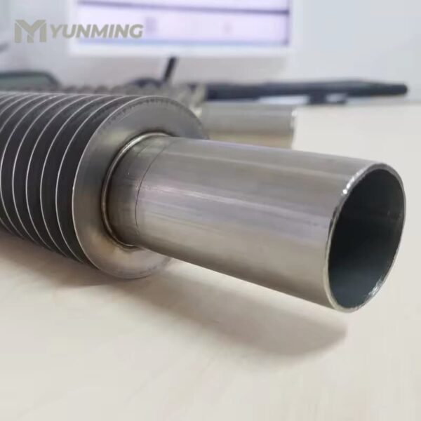 Close-up of welded end of stainless steel finned pipe
