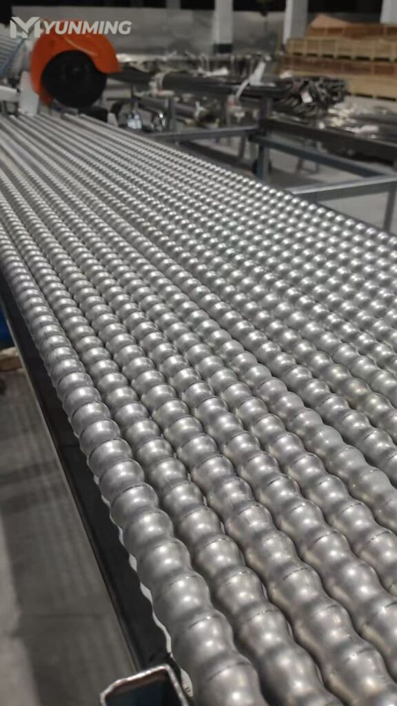 Decorative stainless steel embossed tubes in production line with textured surface finish